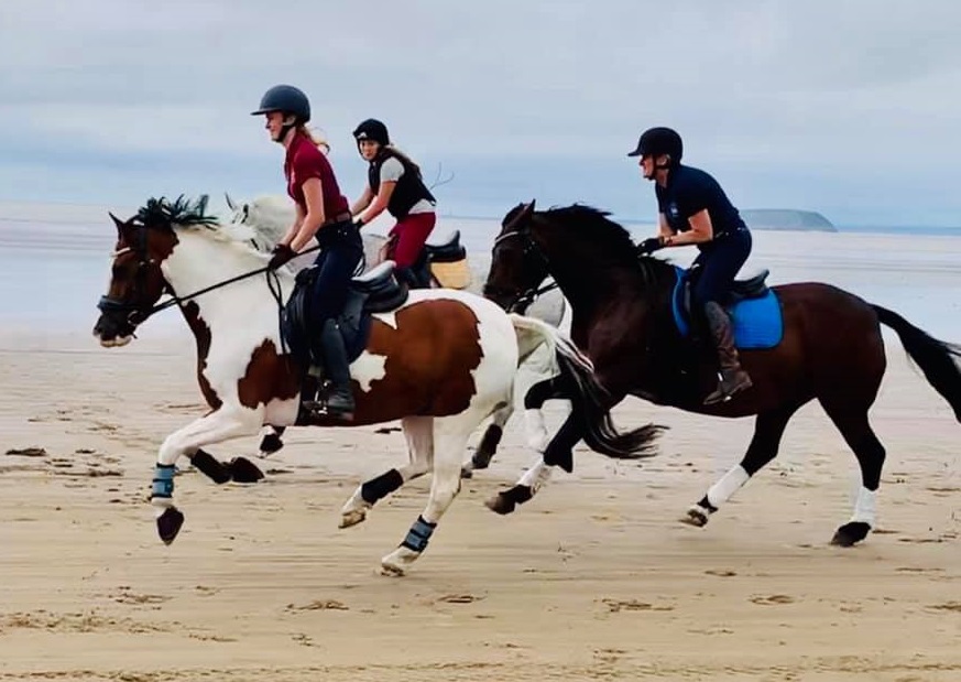 Karen Joynson and April Joynson Horse riding on beach